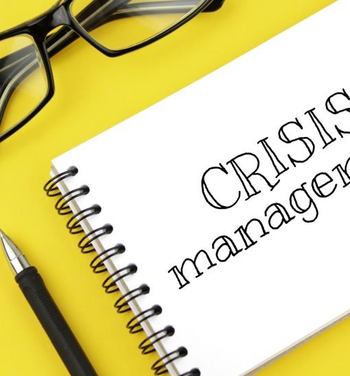 blank paper with inscription crisis management on a yellow background blank paper with inscription crisis management on a yellow background